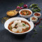 Mini Idlis Dipped In Sambhar (Twelve Pcs)